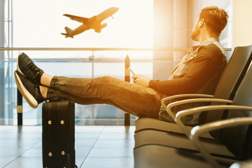 Passenger relaxing at the airport waiting for a private airport transfer